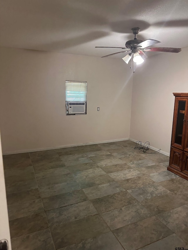 unfurnished room with ceiling fan and cooling unit