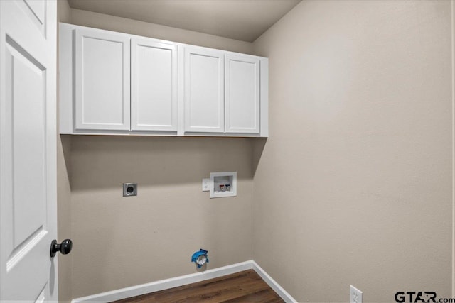 laundry area with washer hookup, cabinets, dark hardwood / wood-style floors, and hookup for an electric dryer