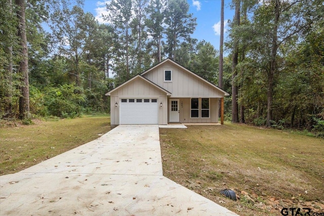 view of front of home featuring a front lawn and a garage