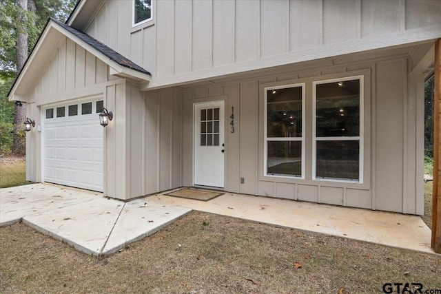 entrance to property featuring a garage