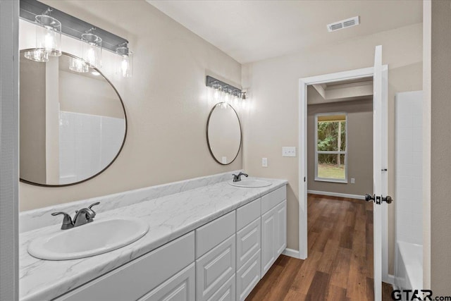 bathroom featuring vanity and hardwood / wood-style flooring