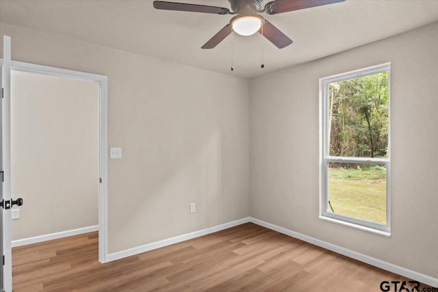 spare room with light hardwood / wood-style floors and ceiling fan