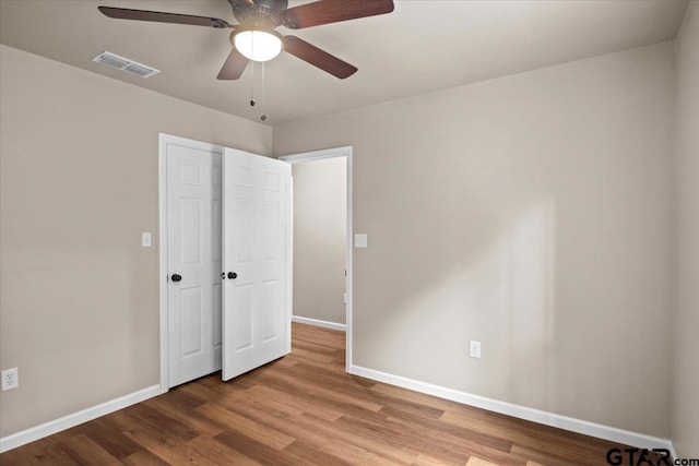 unfurnished bedroom with light hardwood / wood-style floors and ceiling fan