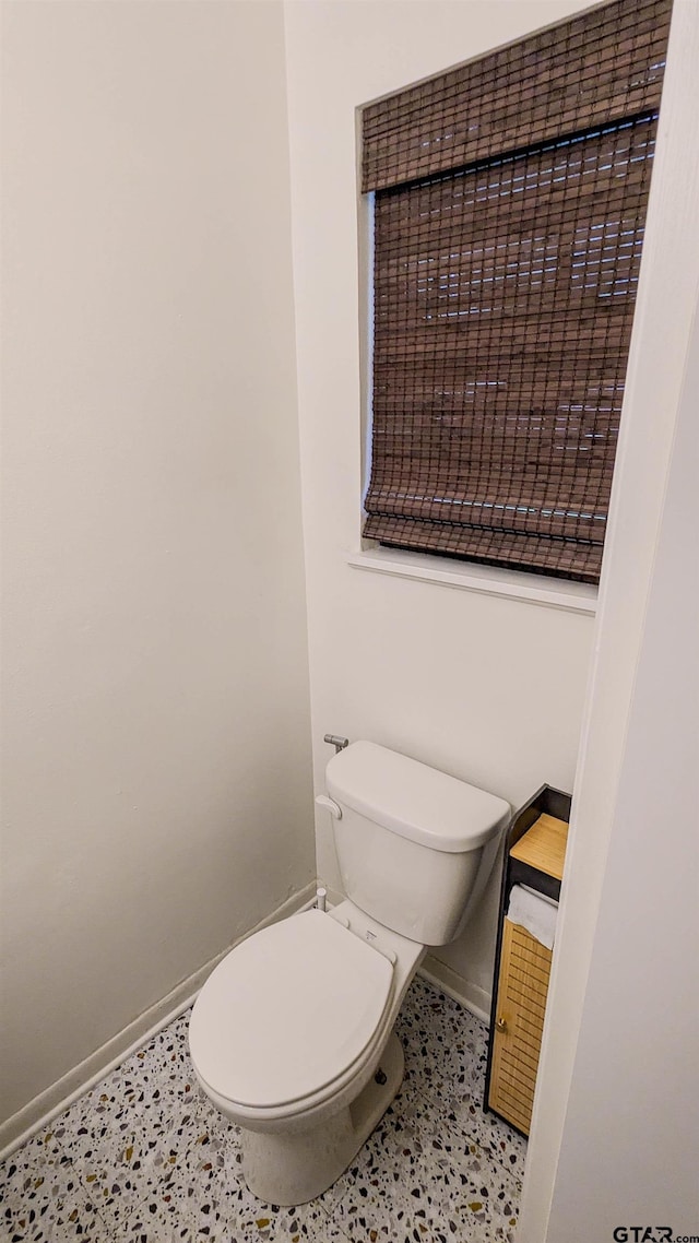1418 E Dawson St, Tyler, TX 75701 - bathroom with baseboards and toilet