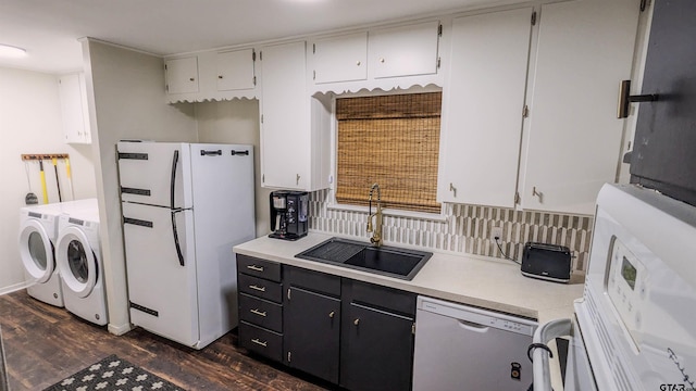 1418 E Dawson St, Tyler, TX 75701 - kitchen featuring separate washer and dryer, freestanding refrigerator, dishwashing machine, dark wood-style floors, and light countertops