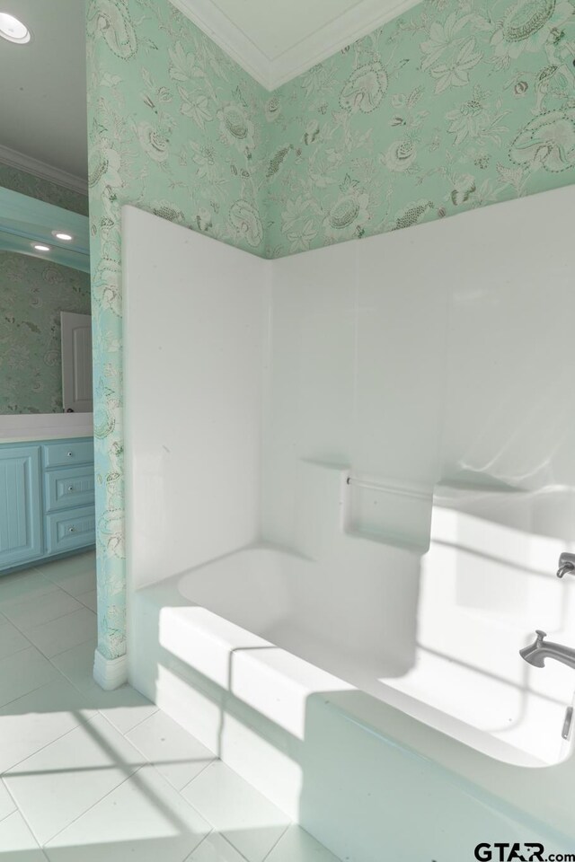 21585 Syrah Ln, Tyler, TX 75703 - bathroom with wallpapered walls, crown molding, a bathtub, and tile patterned flooring