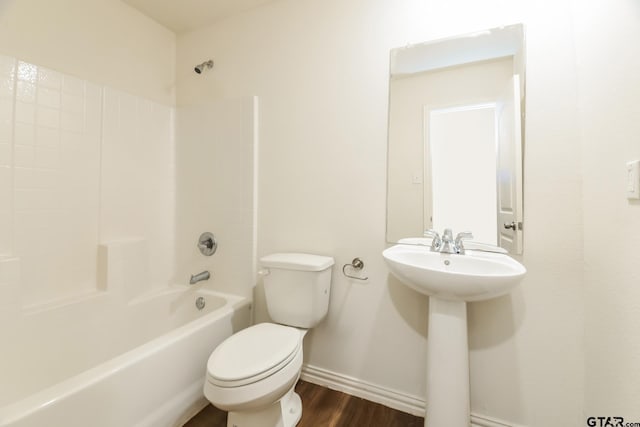 807 W Morris St, Tyler, TX 75702 - bathroom featuring wood finished floors and bathing tub / shower combination
