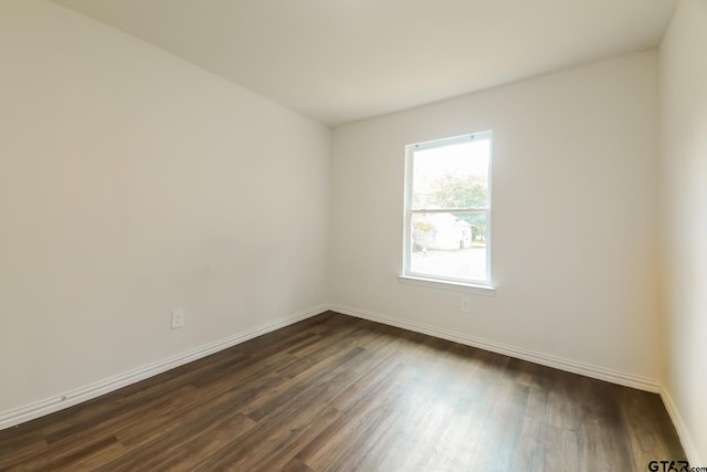 807 W Morris St, Tyler, TX 75702 - unfurnished room with dark wood finished floors and baseboards