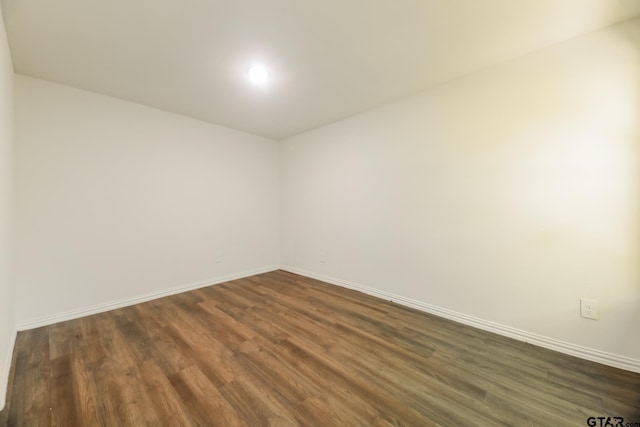 807 W Morris St, Tyler, TX 75702 - empty room featuring dark wood-type flooring and baseboards