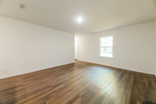 807 W Morris St, Tyler, TX 75702 - empty room with dark wood-type flooring and baseboards