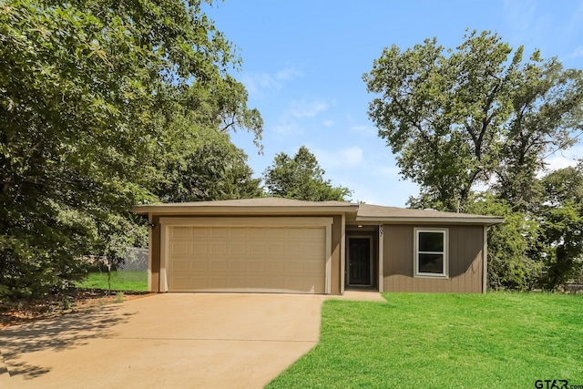 807 W Morris St, Tyler, TX 75702 - view of front of property featuring a garage, concrete driveway, and a front yard