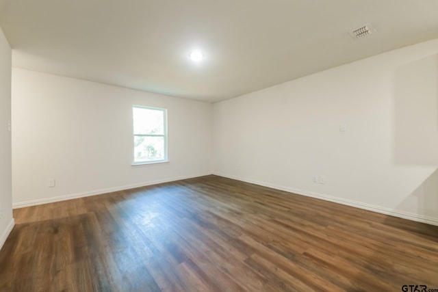 807 W Morris St, Tyler, TX 75702 - spare room featuring dark wood-type flooring
