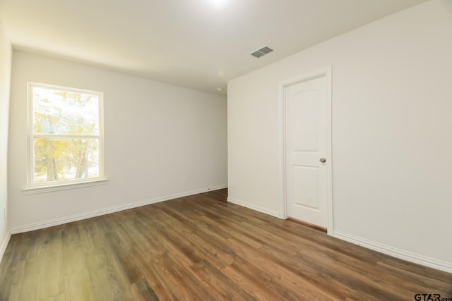 807 W Morris St, Tyler, TX 75702 - empty room with dark wood-style flooring and baseboards