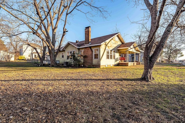 exterior space featuring a yard and central AC unit