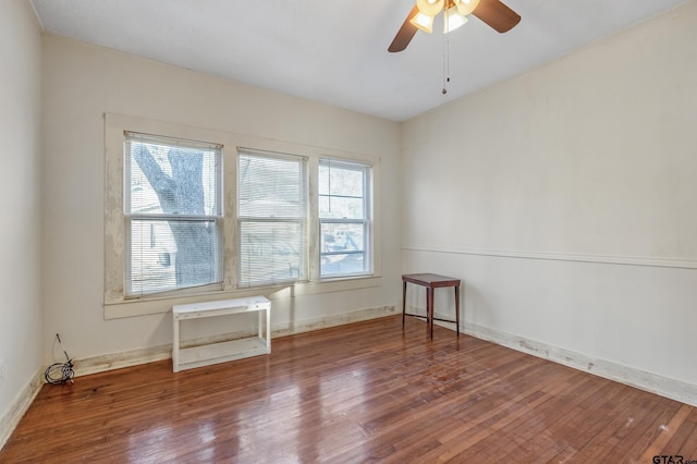 unfurnished room with hardwood / wood-style floors and ceiling fan