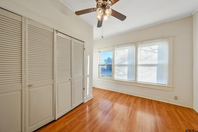 unfurnished bedroom featuring light hardwood / wood-style flooring and ceiling fan