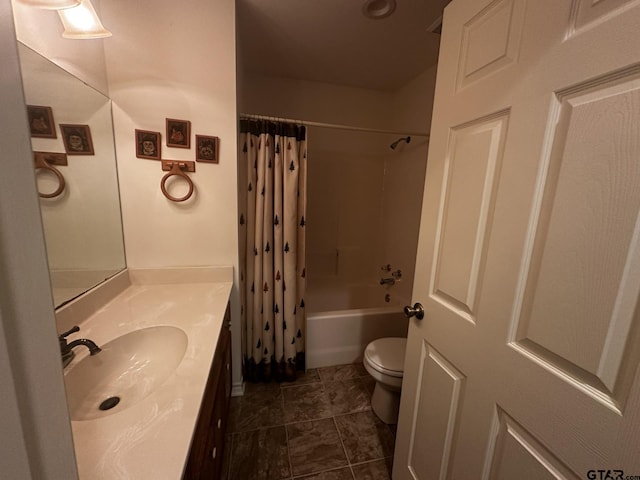 full bathroom with vanity, shower / bath combination with curtain, and toilet