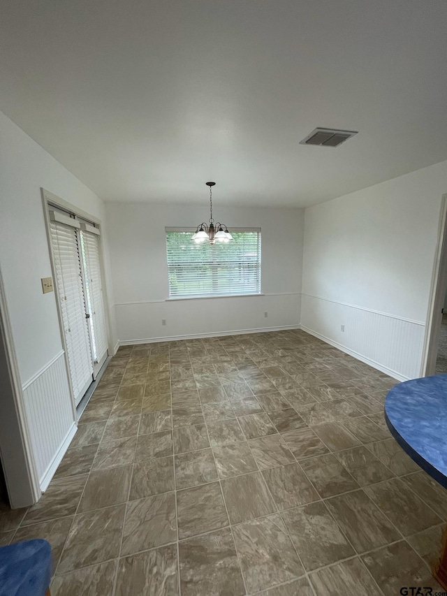 120 An County Road 4287, Palestine, TX 75803 - unfurnished dining area with baseboards, a notable chandelier, and visible vents