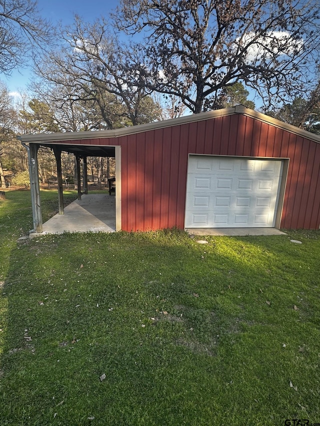 garage featuring driveway and a garage