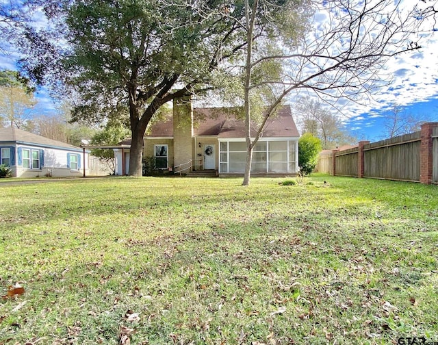 102 Gordon Dr, Crockett, TX 75835 - back of property featuring a sunroom