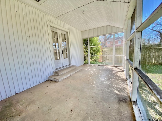102 Gordon Dr, Crockett, TX 75835 - unfurnished sunroom featuring lofted ceiling, entry steps, and french doors