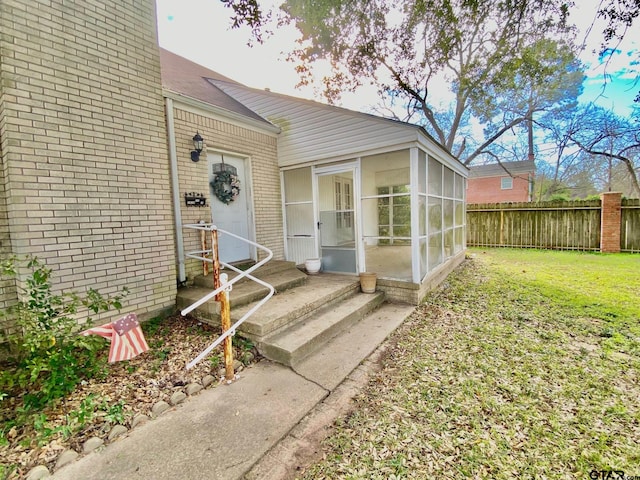 102 Gordon Dr, Crockett, TX 75835 - view of exterior entry featuring brick siding