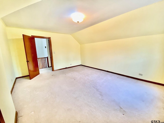 102 Gordon Dr, Crockett, TX 75835 - additional living space with vaulted ceiling and light carpet