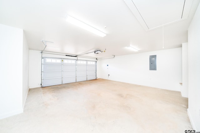 garage featuring electric panel and a garage door opener