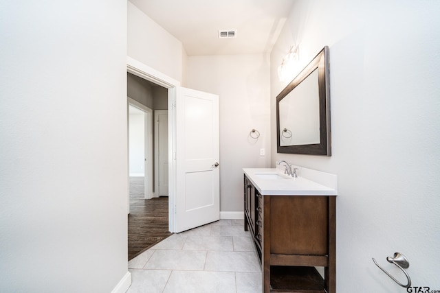 bathroom with tile patterned floors and vanity