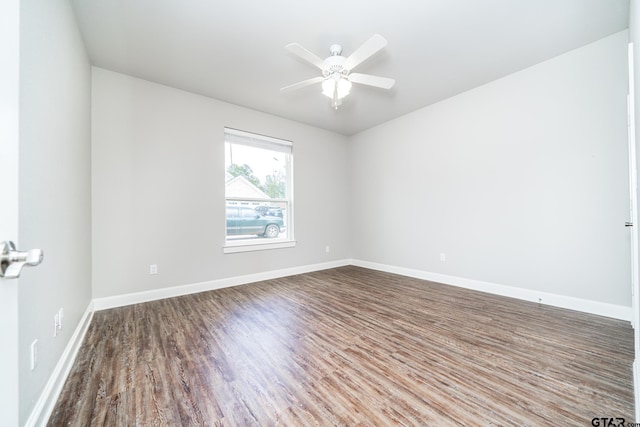 unfurnished room with ceiling fan and wood-type flooring