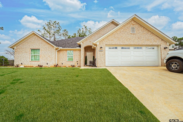 view of front of property with a garage and a front lawn