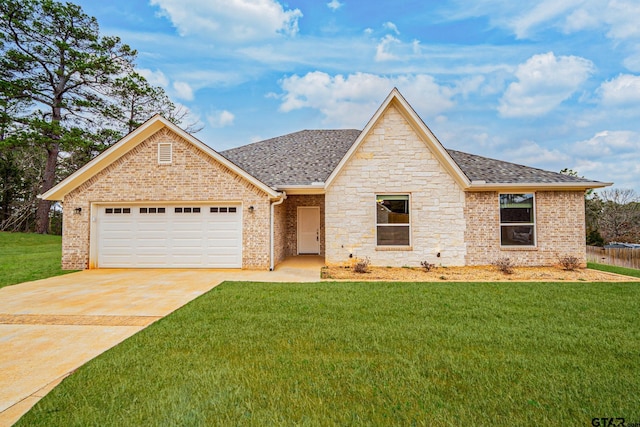 view of front of house with a garage and a front yard