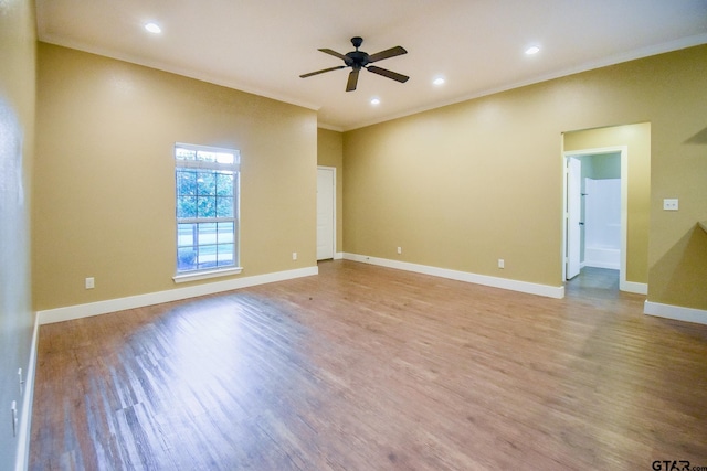 empty room featuring ornamental molding, ceiling fan, and light hardwood / wood-style floors