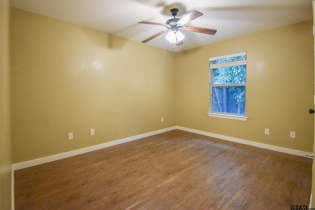 empty room with wood-type flooring and ceiling fan