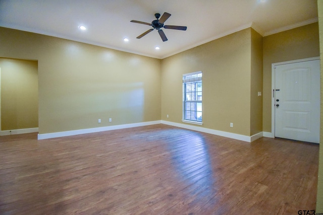 unfurnished room with hardwood / wood-style flooring, ceiling fan, and ornamental molding