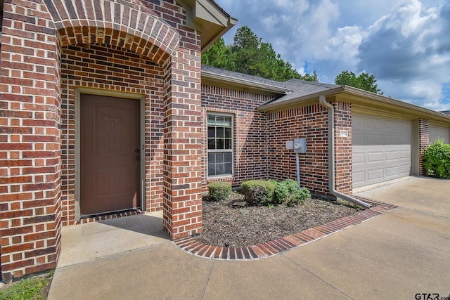 entrance to property featuring a garage