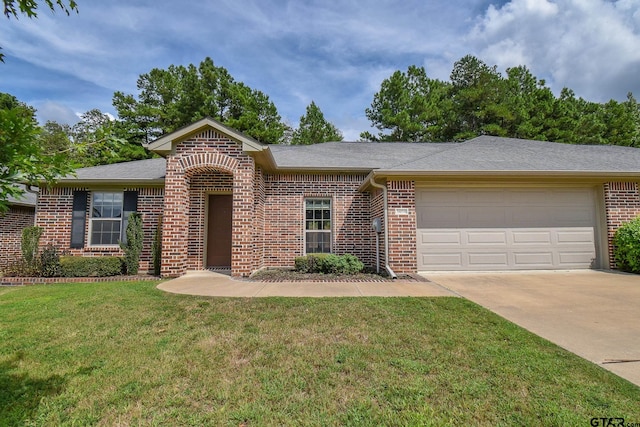 ranch-style home with a garage and a front yard