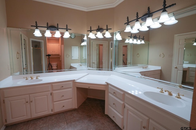 bathroom with ornamental molding, vanity, and tile patterned floors