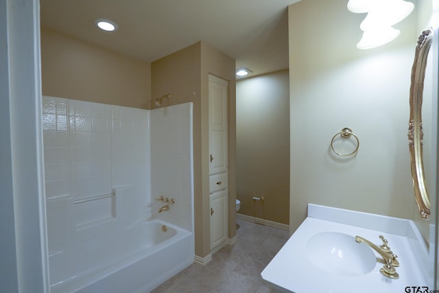 full bathroom featuring vanity, tile patterned floors, washtub / shower combination, and toilet