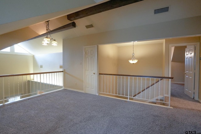 carpeted spare room with lofted ceiling with beams and a notable chandelier