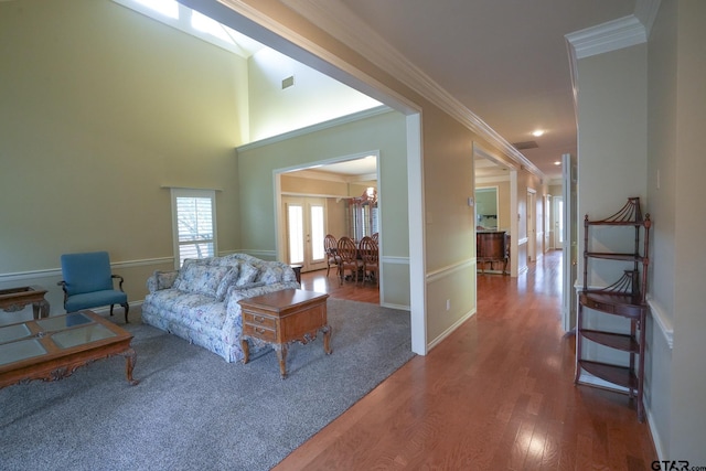 living room featuring hardwood / wood-style flooring and ornamental molding