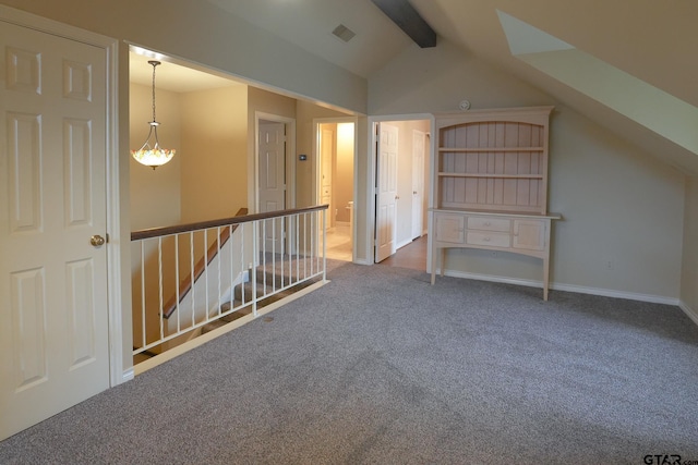 additional living space with lofted ceiling with beams and carpet