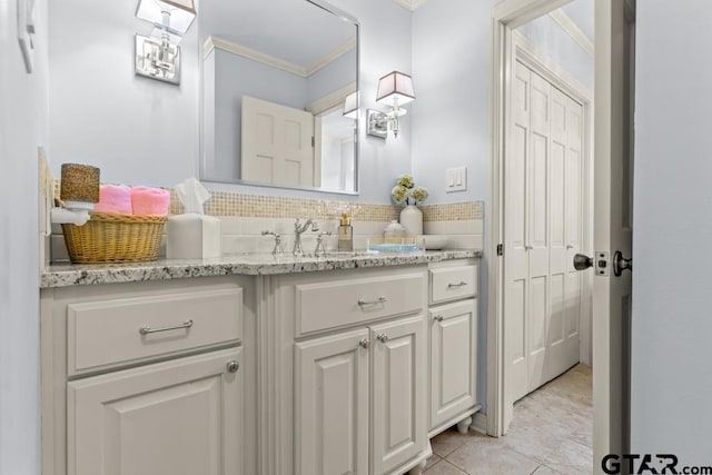 1805 Greenway St, Gilmer, TX 75644 - bathroom featuring crown molding, vanity, tile patterned floors, and tasteful backsplash