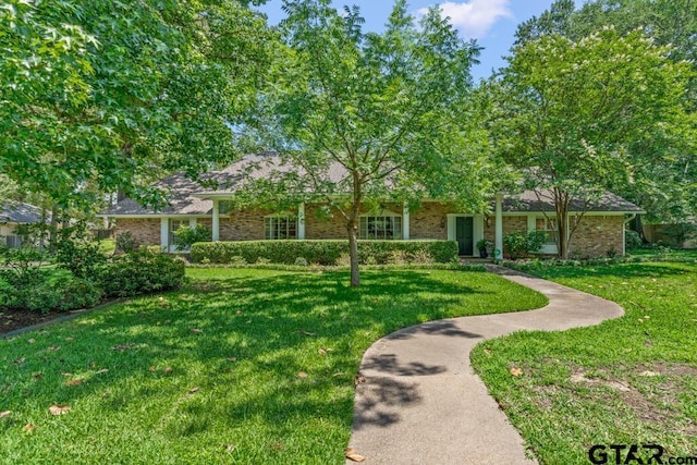 1805 Greenway St, Gilmer, TX 75644 - view of front of property featuring a front lawn and brick siding