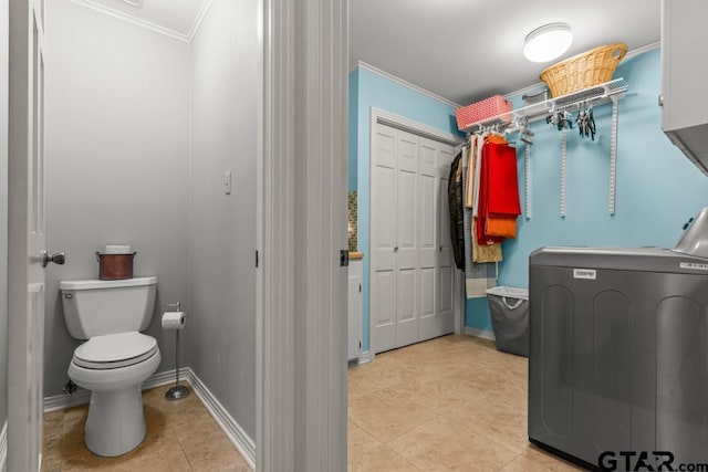 1805 Greenway St, Gilmer, TX 75644 - laundry area featuring washer / clothes dryer, ornamental molding, light tile patterned floors, and baseboards
