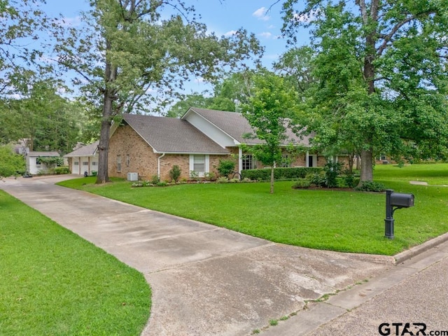 1805 Greenway St, Gilmer, TX 75644 - view of front facade with brick siding, a front lawn, a garage, and roof with shingles