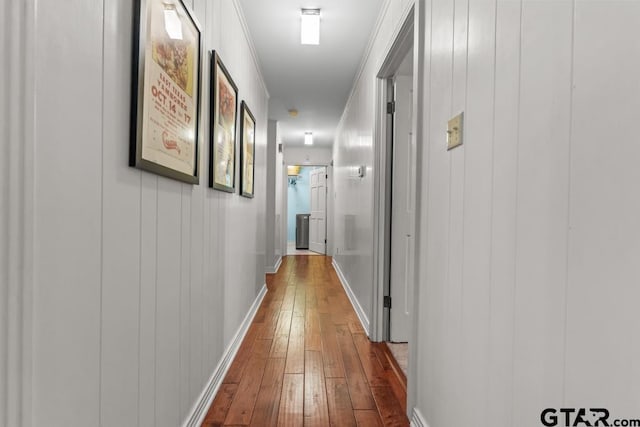 1805 Greenway St, Gilmer, TX 75644 - hallway with dark wood-style floors and baseboards