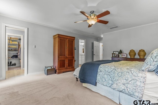 1805 Greenway St, Gilmer, TX 75644 - bedroom with crown molding, carpet flooring, a spacious closet, a closet, and a ceiling fan