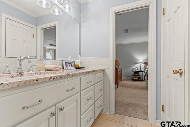 1805 Greenway St, Gilmer, TX 75644 - bathroom with vanity, tile patterned flooring, a chandelier, and ornamental molding