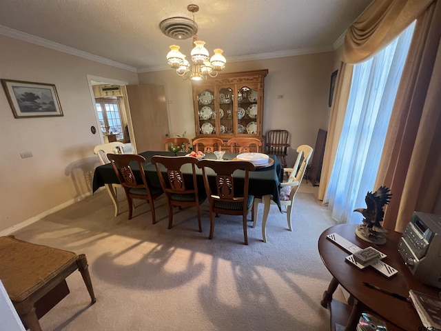 dining area with an inviting chandelier, ornamental molding, and carpet